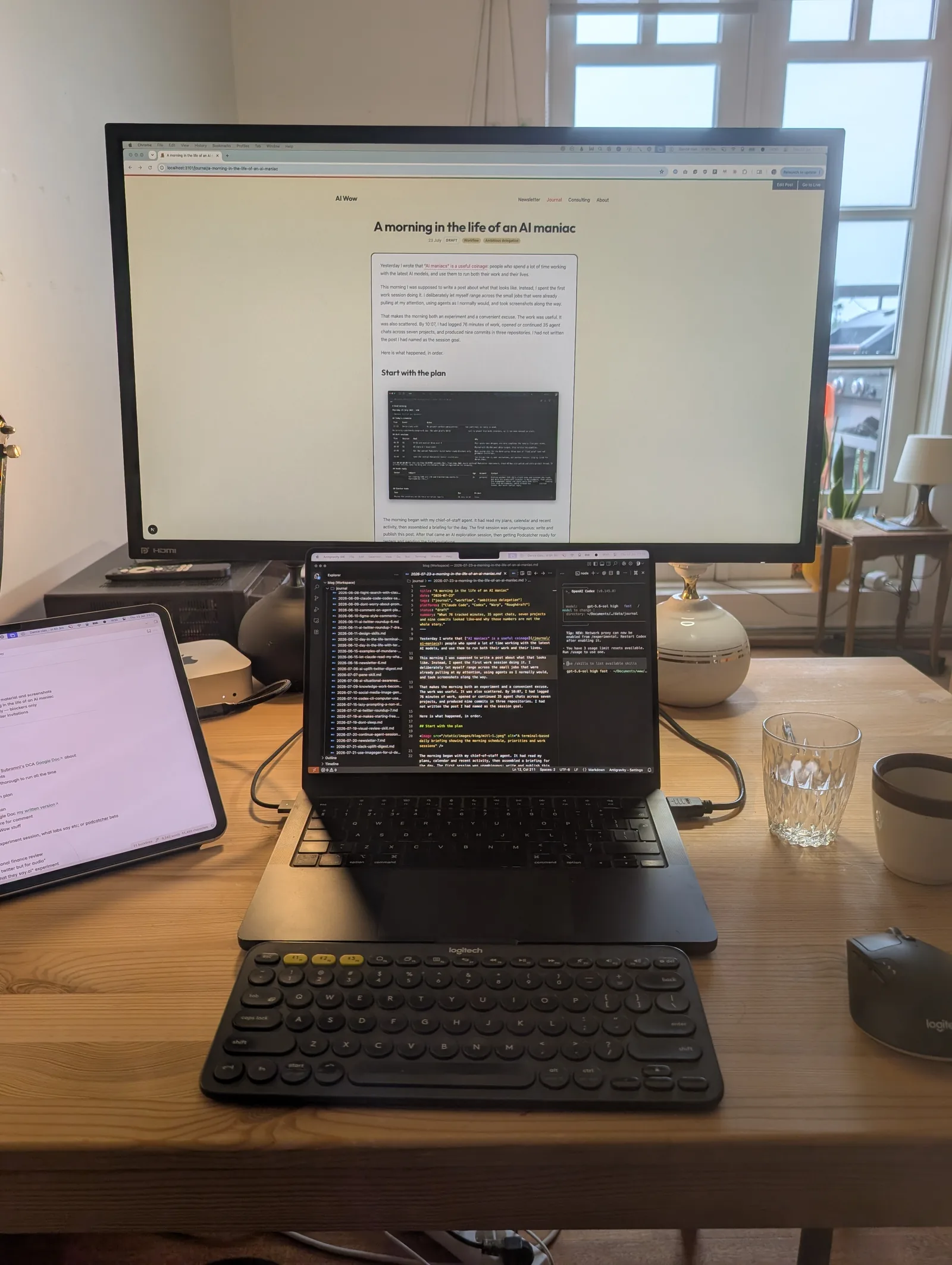 My desk with the AI Wow preview on the monitor and the post source open on my laptop